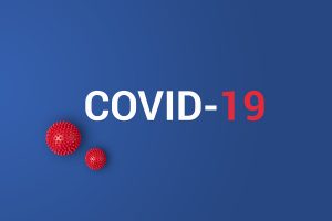 Image of coronavirus with the words COVID-19 in white and red.
