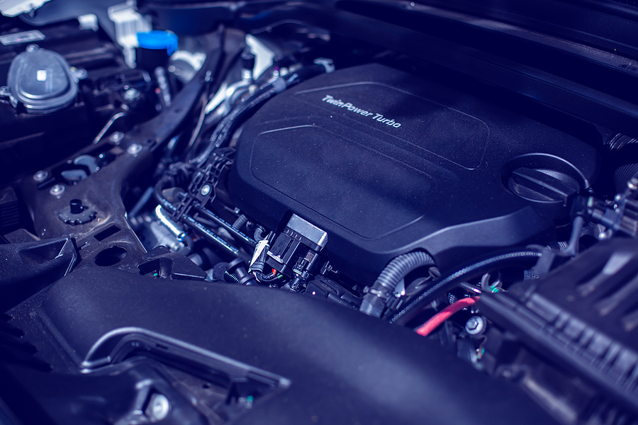 A car engine with numerous heat-resistant plastic parts. 