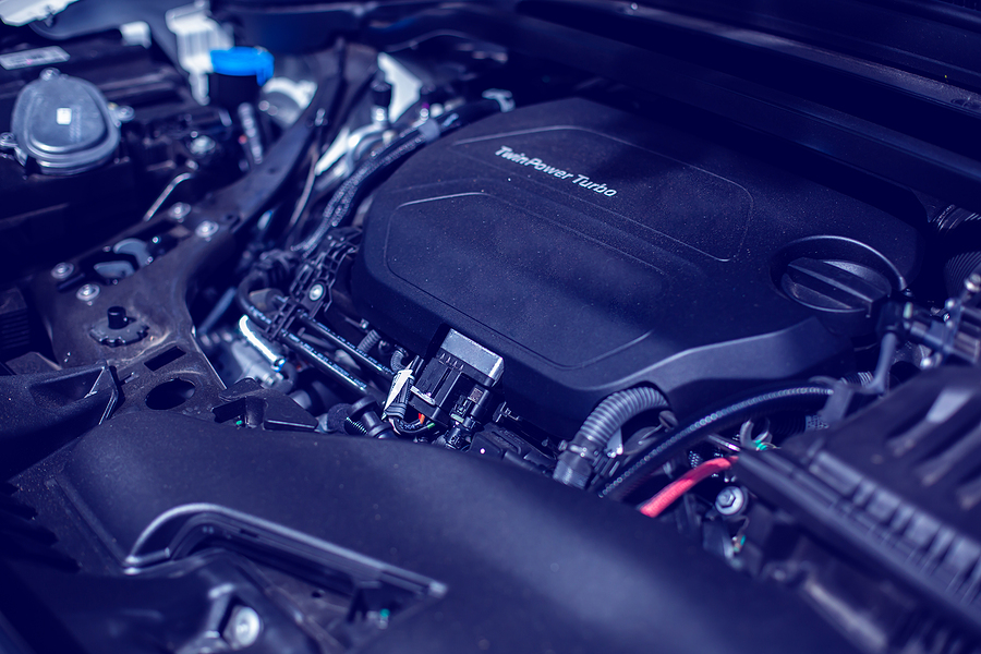 A car engine with numerous heat-resistant plastic parts.
