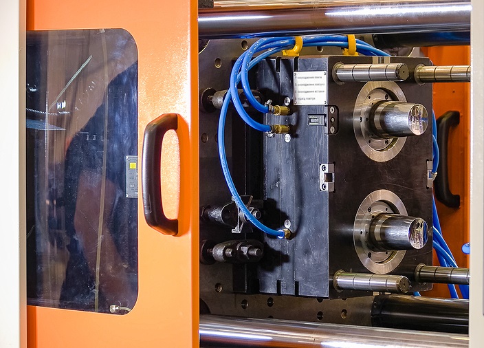 Close-up of a plastic injection molding machine.