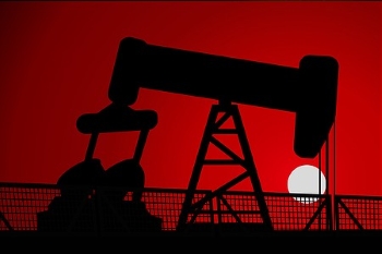Profile of a oil pump jack in red with a white sun behind it.